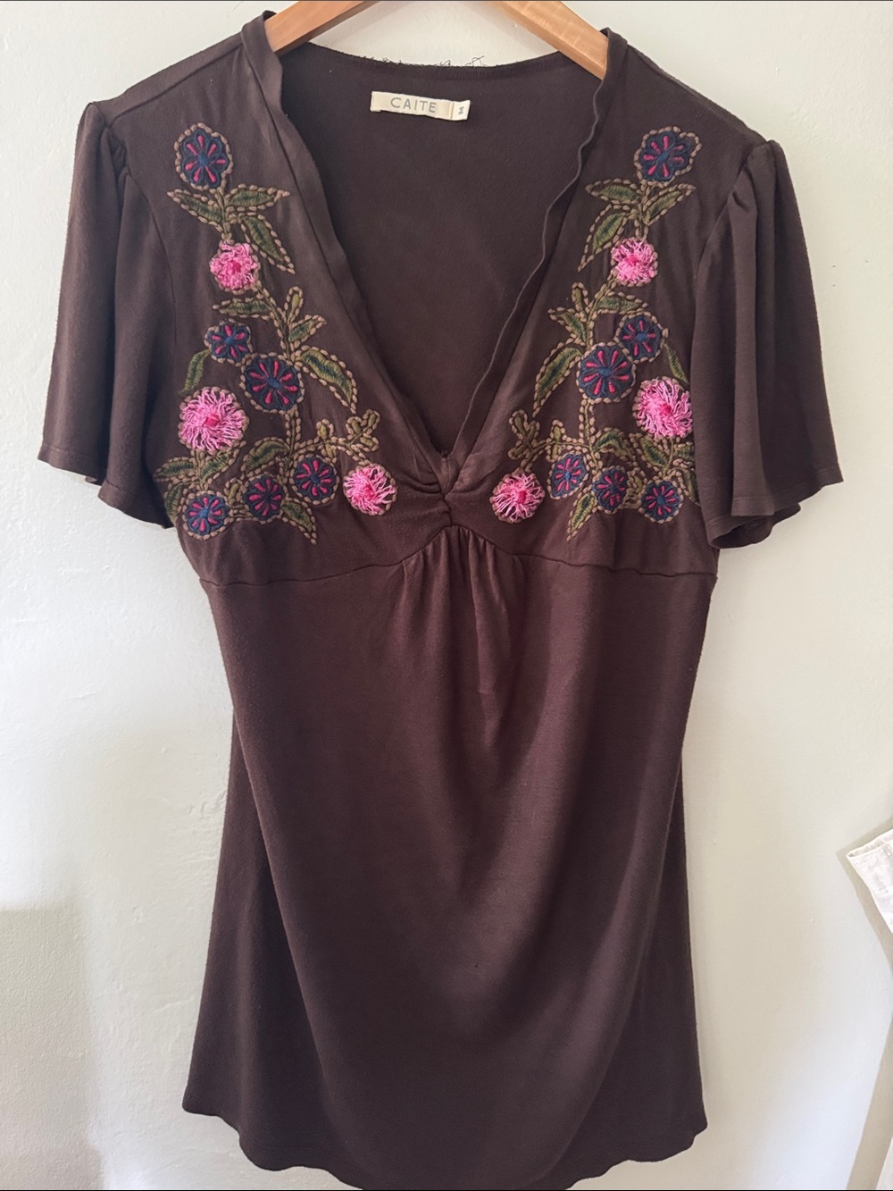 Caite Brown Embroidered V-Neck Women’s Top with Pink Floral Detail